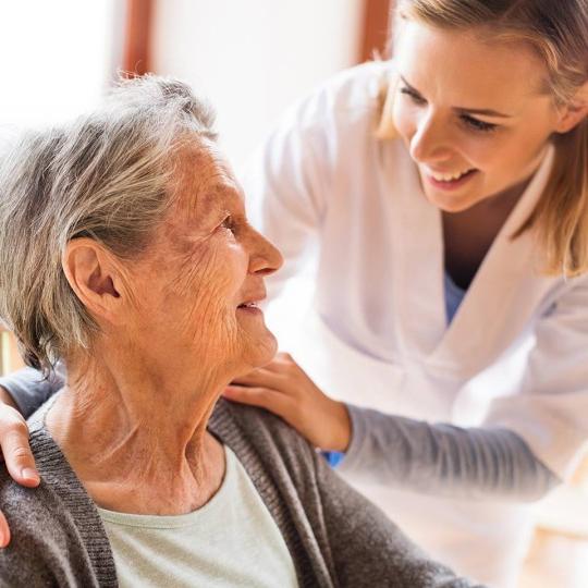 Medical professional with elderly woman